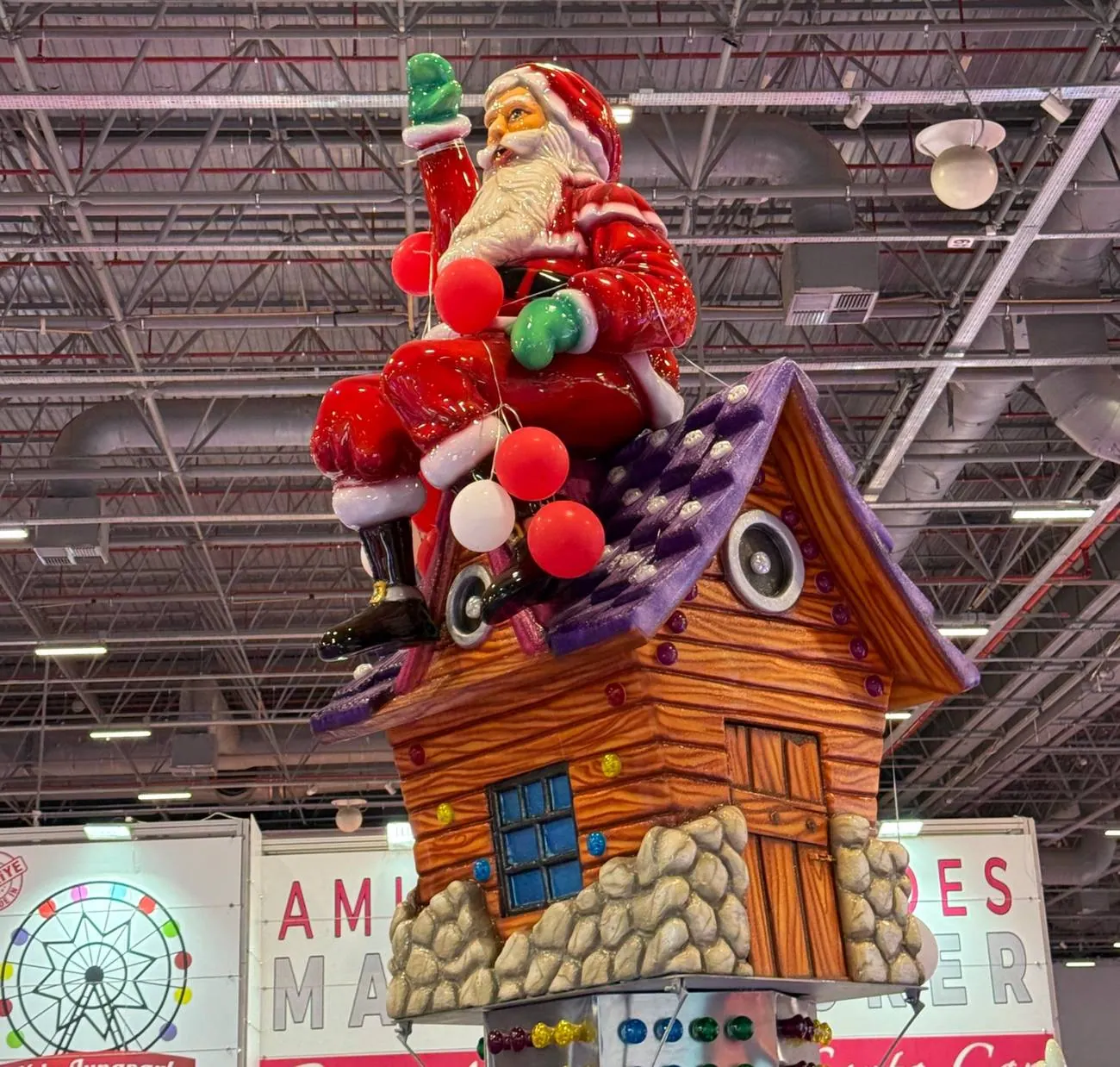 Oversized Santa Claus sculpture on a rooftop